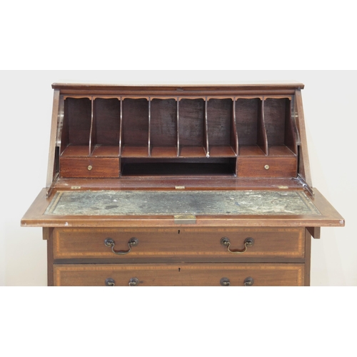 924 - An Edwardian Sheraton revival mahogany and satinwood crossbanded bureau, the fall front centred with... 