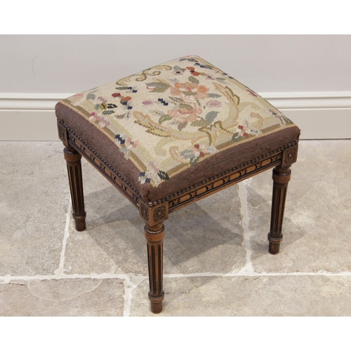 936 - An early 20th century stained beech footstool, with tapestry upholstered square top above a carved f... 