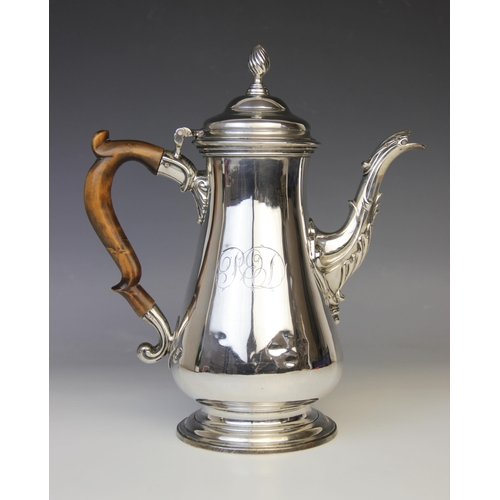 97 - A George III silver hot water jug by Louise Black, London 1764, of baluster form on circular foot, c... 