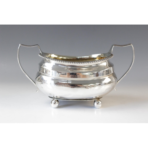 59 - A George III silver milk jug by Solomon Hougham, London 1814, of oval bellied form with reeded borde... 