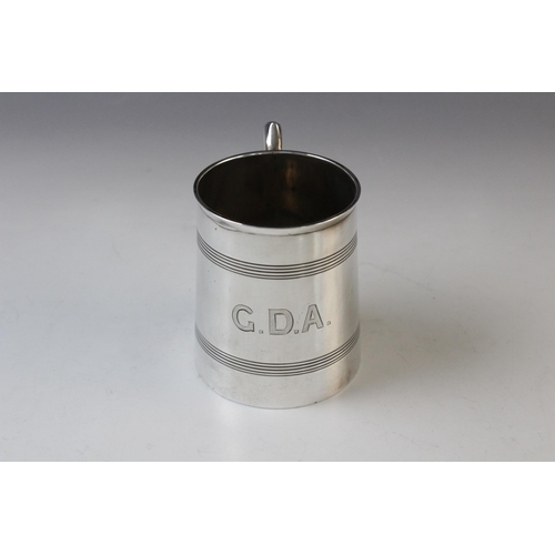 65 - An Edwardian silver mug by Levesley Brothers, Sheffield 1903, of tapering cylindrical 'coopered' for... 