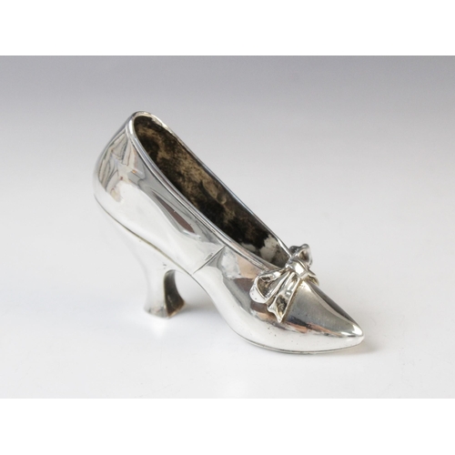 67 - A Victorian silver model of a shoe by Edward H Stockwell, London 1890, marked to base 'Albert Barker... 