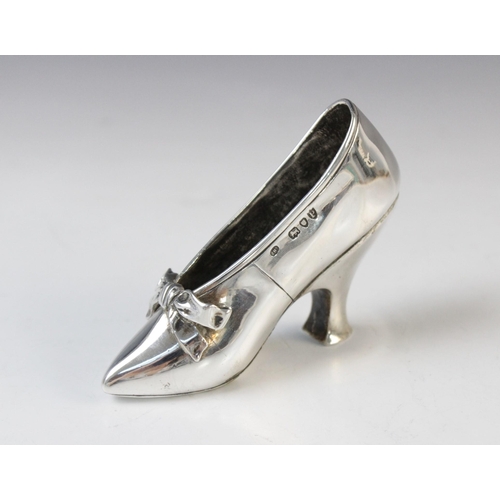 67 - A Victorian silver model of a shoe by Edward H Stockwell, London 1890, marked to base 'Albert Barker... 