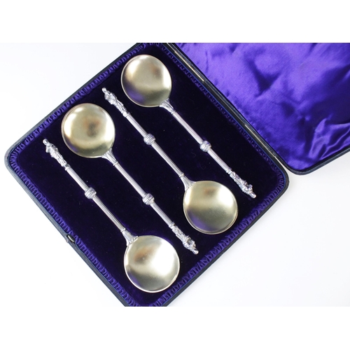 79 - A Victorian cased set of four silver and silver gilt apostle spoons by Army & Navy Co-operative Soci... 