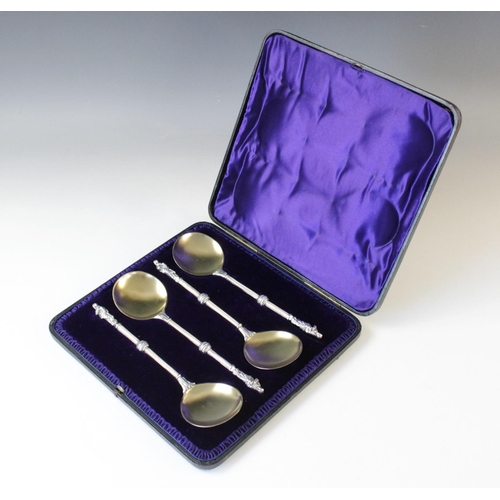 79 - A Victorian cased set of four silver and silver gilt apostle spoons by Army & Navy Co-operative Soci... 