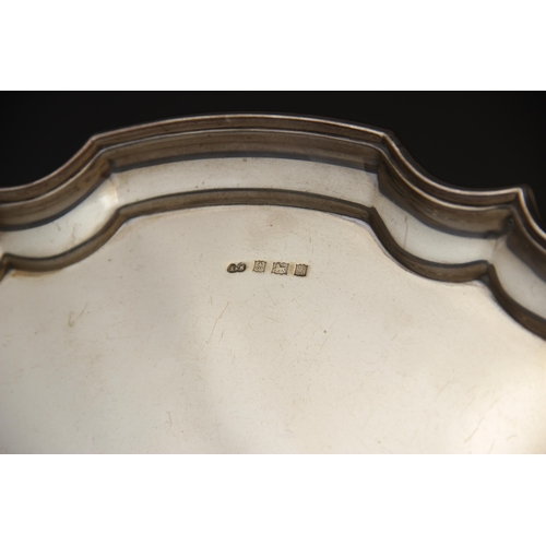 124 - A silver salver by Sanders & McKenzie, Birmingham 1969, of circular form with pie-crust border on th... 