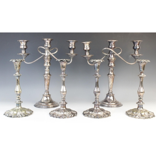 147 - A pair of silver plated candelabras by Elkington & Co, each with tapering knopped columns on stepped... 