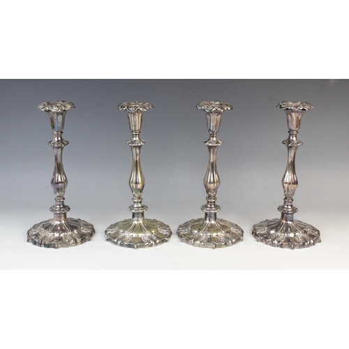 147 - A pair of silver plated candelabras by Elkington & Co, each with tapering knopped columns on stepped... 