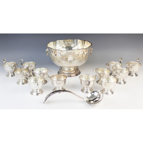 148 - A mid-20th century silver plated punch bowl, of circular form with shaped rim and gadroon border on ... 