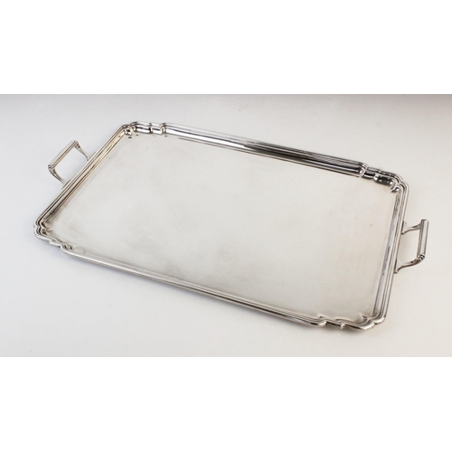 117 - A large twin-handled silver tray by Mappin & Webb, Sheffield 1979, of plain polished rectangular for... 