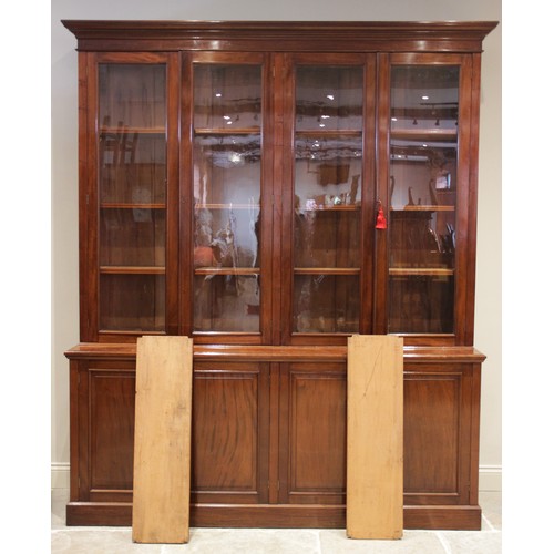 887 - A mid 19th century mahogany library bookcase, the moulded cornice above a plain frieze and two pairs... 