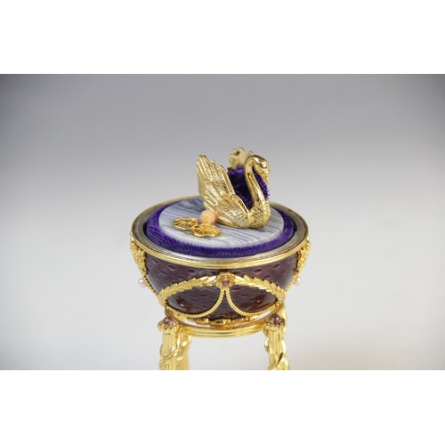 115 - A Frankin Mint 1984 House of Igor Carl Faberge Imperial Anniversary Egg, the silver egg with purple ... 