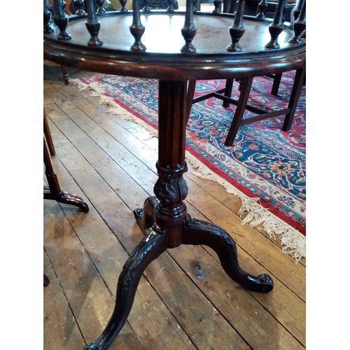 889 - A 19th century and later Chippendale style galleried mahogany wine table, the circular top with a sp... 