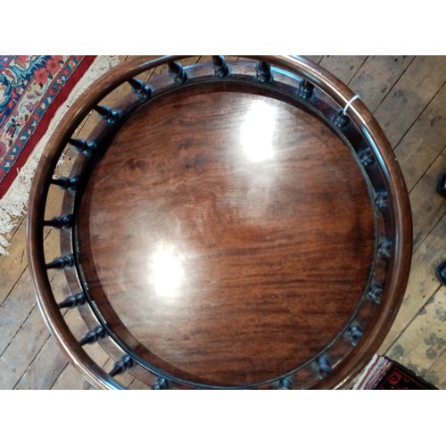 889 - A 19th century and later Chippendale style galleried mahogany wine table, the circular top with a sp... 