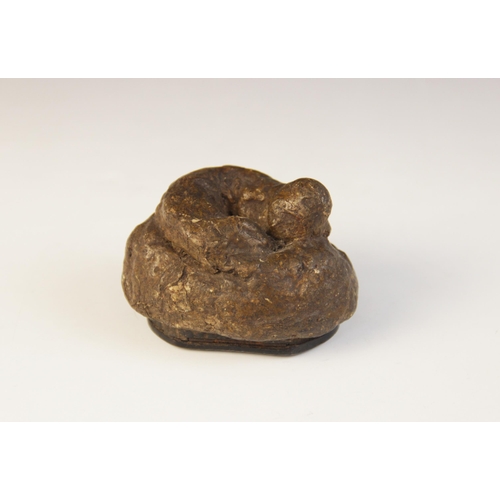 106 - A Victorian novelty papier mache snuff box, designed as a dogs faeces, hinged cover, 7cm wide