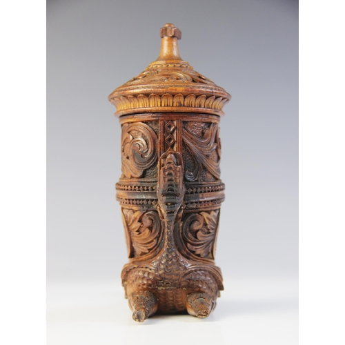 107 - A Scandinavian treen Cornucopia/horn vessel and cover, 20th century, extensively carved with scrolls... 