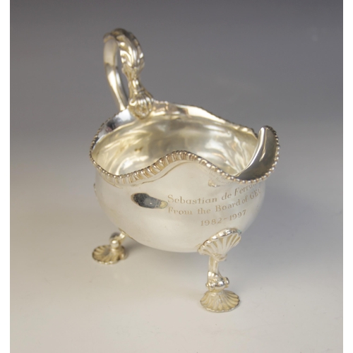 14 - A George III silver sauce boat, marks for London 1761 (maker's marks worn), of typical form with wav... 