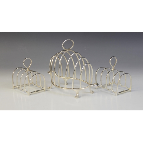 16 - A Victorian silver six-division toast rack, Henry Wilkinson & Co, London 1893, the shaped base with ... 