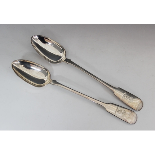 19 - A pair of Victorian silver fiddle pattern serving spoons, Reid & Sons, Newcastle 1871, each thumbpie... 
