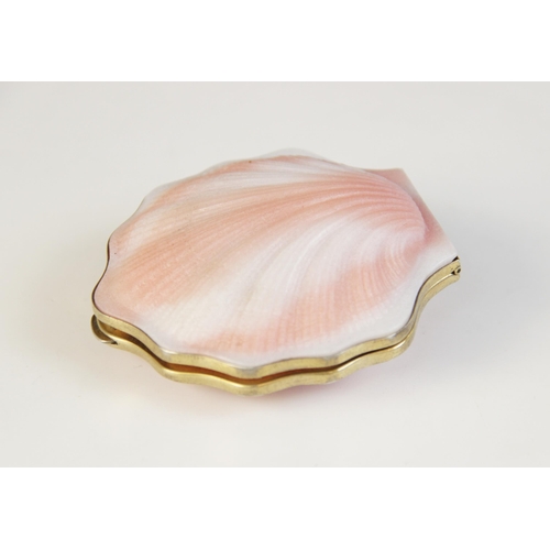 46 - A Russian silver gilt coloured glass shell form compact, the white and pink exterior with shell effe... 