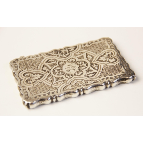 55 - A Victorian silver card case by George Unite, Birmingham 1872, of shaped rectangular form, chased ge... 