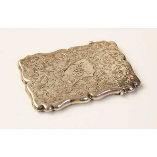 56 - An Edwardian silver card case, W G Keight & Co, Birmingham 1901, of shaped rectangular form, scrolli... 