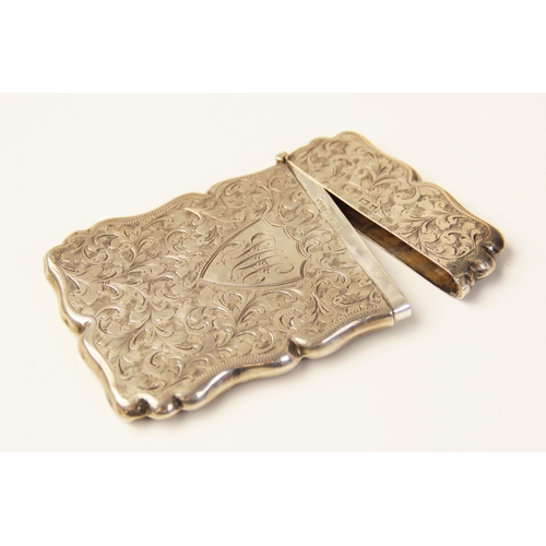56 - An Edwardian silver card case, W G Keight & Co, Birmingham 1901, of shaped rectangular form, scrolli... 