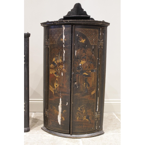 581 - A 19th century Japanned bowfront hanging corner cupboard, the twin doors applied with painted detail... 