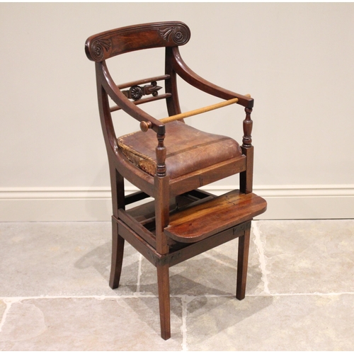 584 - A George IV mahogany child’s highchair, with correction bar, the concave top rail with carved flower... 