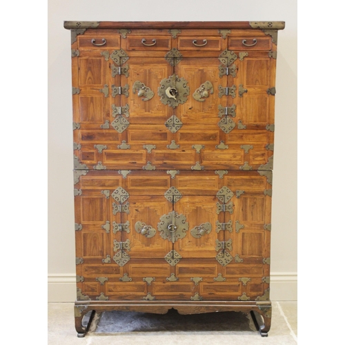 590 - A Korean two piece side cabinet, probably pear wood and elm, late 19th century, the upper chest with... 