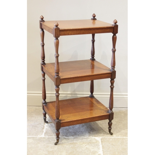 594 - A Victorian mahogany etagere/what-not, the conical shaped finials upon ring turned baluster shaped u... 