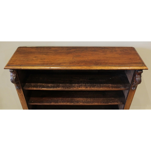 595 - A Victorian rosewood open bookcase, the rectangular moulded top above three adjustable shelves, flan... 