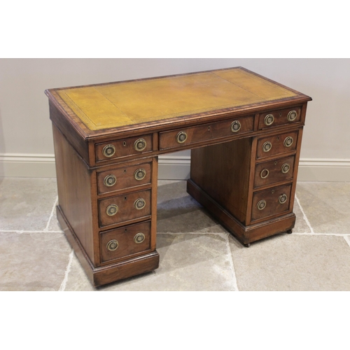 596 - A late 19th century mahogany twin pedestal desk, the rectangular moulded top inset with a leather sk... 