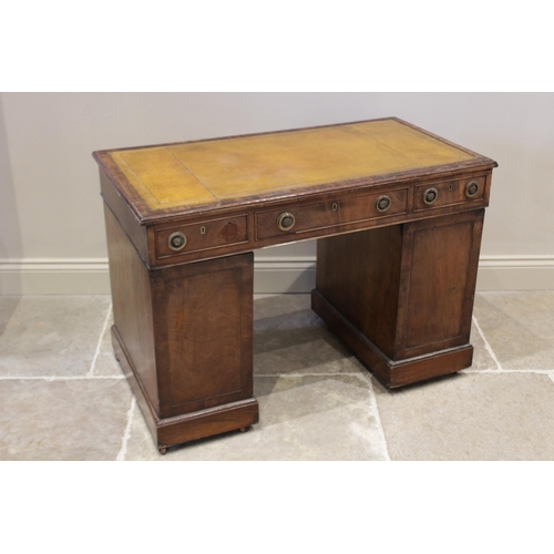 596 - A late 19th century mahogany twin pedestal desk, the rectangular moulded top inset with a leather sk... 