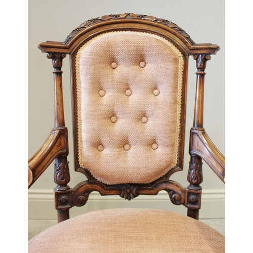 599 - A French walnut salon chair, circa 1880, the arched button back below leaf and berry carved detail a... 