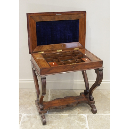 604 - A mid 19th century yew wood work or stationery table, the rectangular moulded and hinged top inlaid ... 