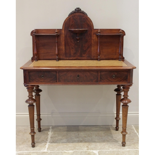 607 - A 19th century and later mahogany writing table, the shaped high back with four slender pilasters, a... 