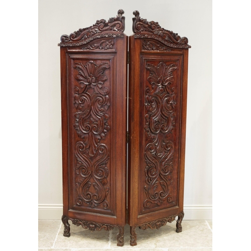 612 - A late 19th/early 20th century carved walnut Rococo style twin panel screen, each screen with a scro... 