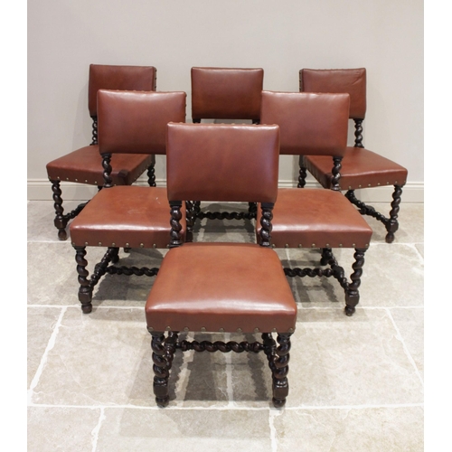 617 - A set of six Victorian 17th century revival oak dining chairs, each chair with a padded back rest an... 