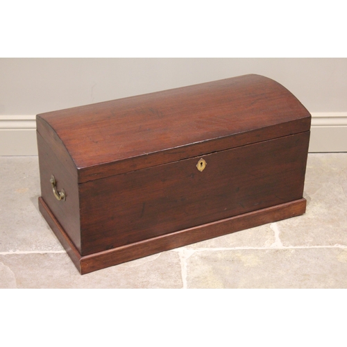 624 - A 19th Century mahogany domed trunk, applied with brass side swing handles, opening to a removable t... 