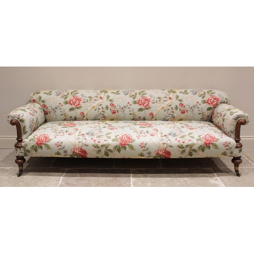 632 - A Victorian Howard type sofa, upholstered in Morris & Co 'Tangley' fabric on an eggshell ground, the... 