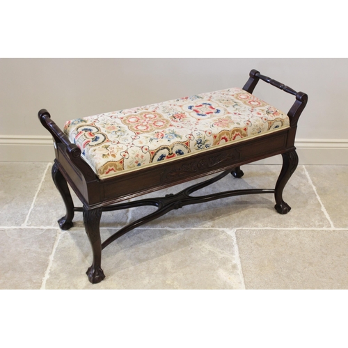 637 - An Edwardian mahogany Chippendale revival duet piano stool, the hinged tapestry and upholstered top ... 