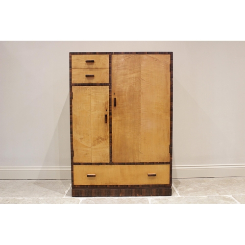 643 - An Art Deco style satin birch and cross banded gentleman's wardrobe, mid 20th century, of rectangula... 