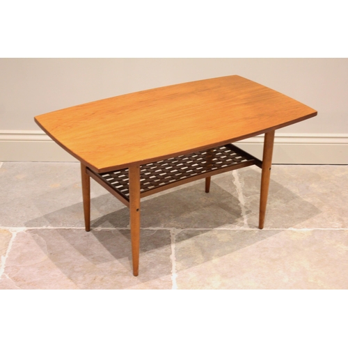 647 - A Scandinavian teak coffee table by Albert Larson, the swelling rectangular top raised upon tapering... 