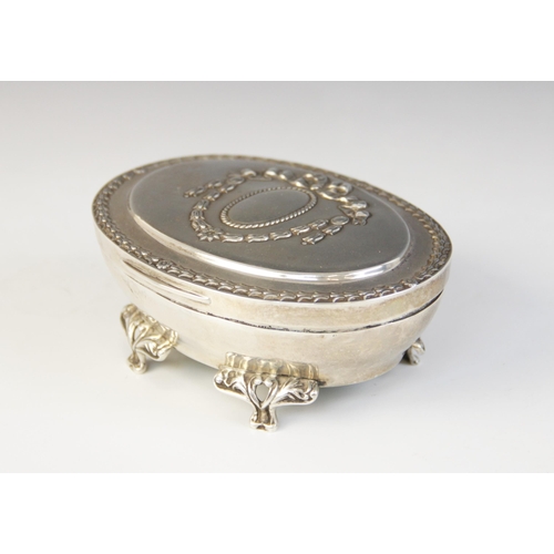 65 - An Edwardian silver mounted jewellery casket, Henry Matthews, Birmingham 1906, of tapered oval form ... 