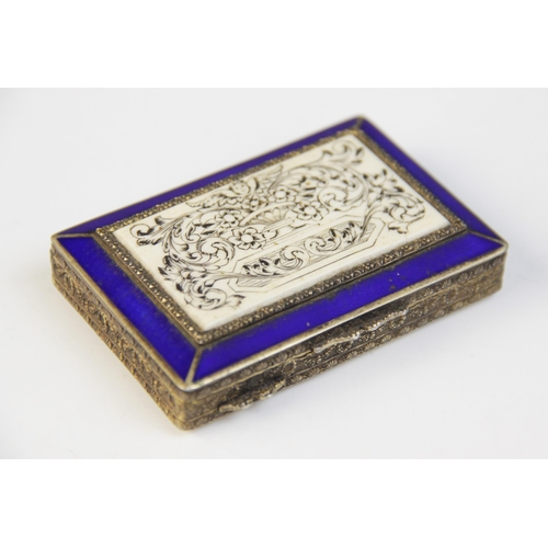 73 - A continental silver gilt and enamel minaudière, of rectangular form, the cover set with an engraved... 