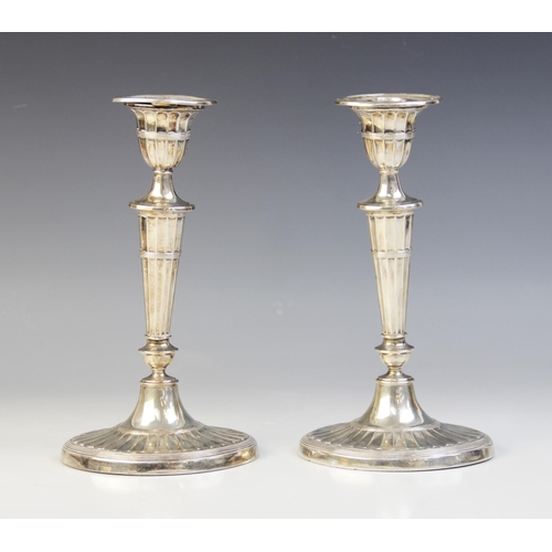 74 - A pair of late Victorian silver candlesticks, Harrison Brothers & Howson, Sheffield 1899, each with ... 