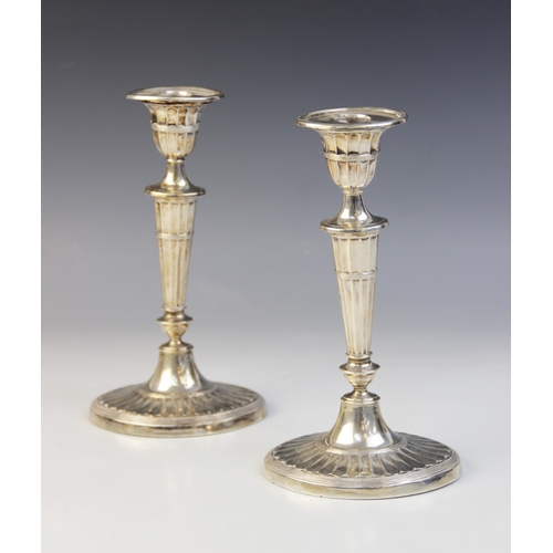 74 - A pair of late Victorian silver candlesticks, Harrison Brothers & Howson, Sheffield 1899, each with ... 