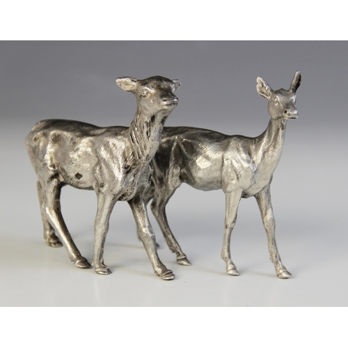 84 - Two silver plated models of deer, each realistically modelled with fur effect chasing, one numbered ... 