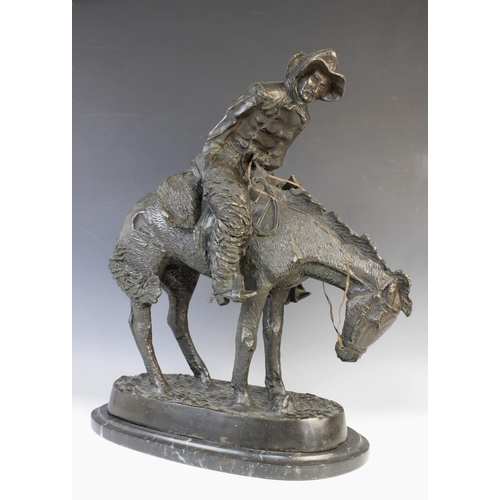 117 - After Frederic Remmington (American, 1861-1909), 'The Norther', a patinated bronze figural group mod... 